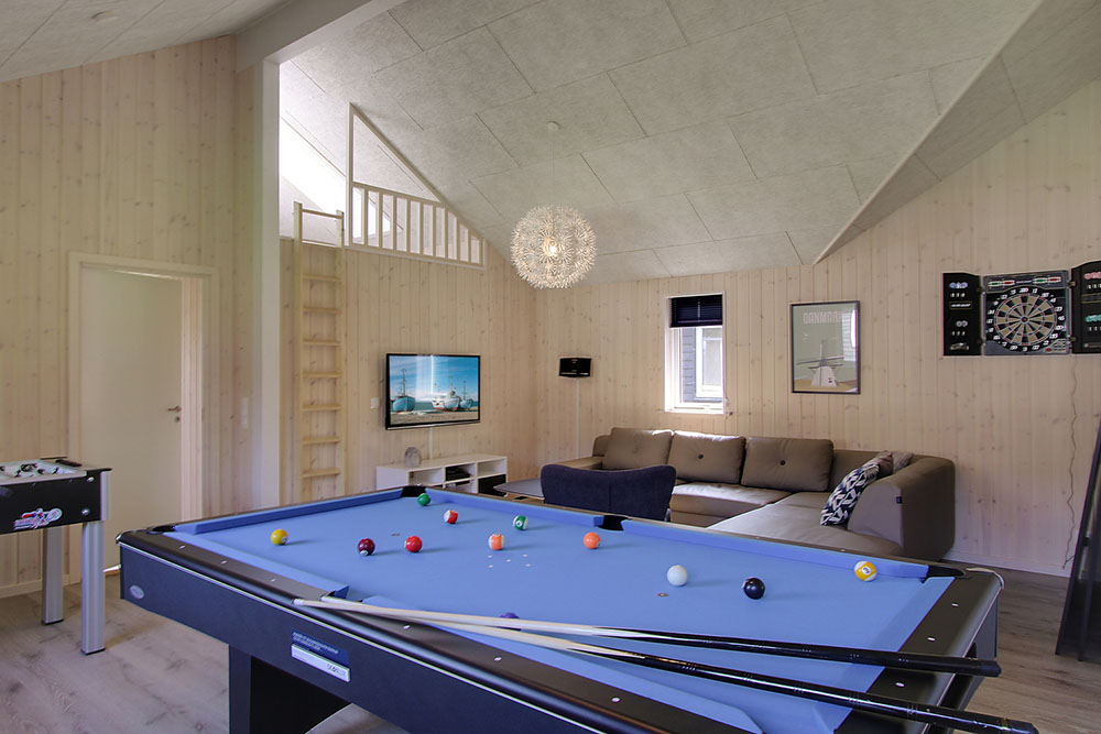 Ud over de mange timer, man kan bruge i husets pool-afdeling, så byder luksushus 713 også på billard/bordtennis og dart