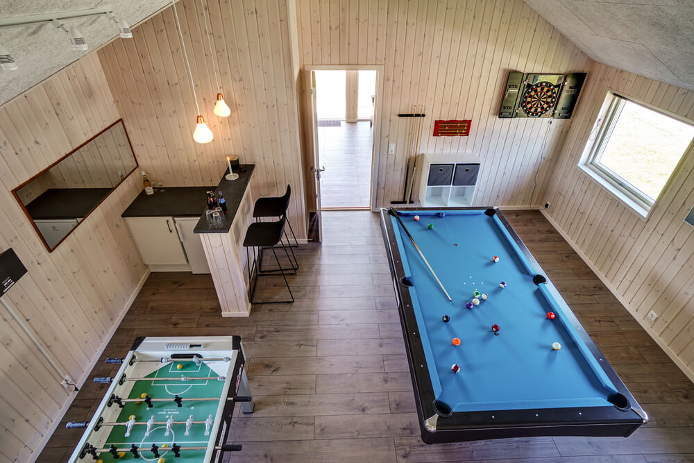 Ud over de mange timer, man kan bruge i husets pool-afdeling, så byder luksushus 718 også på billard/bordtennis og dart