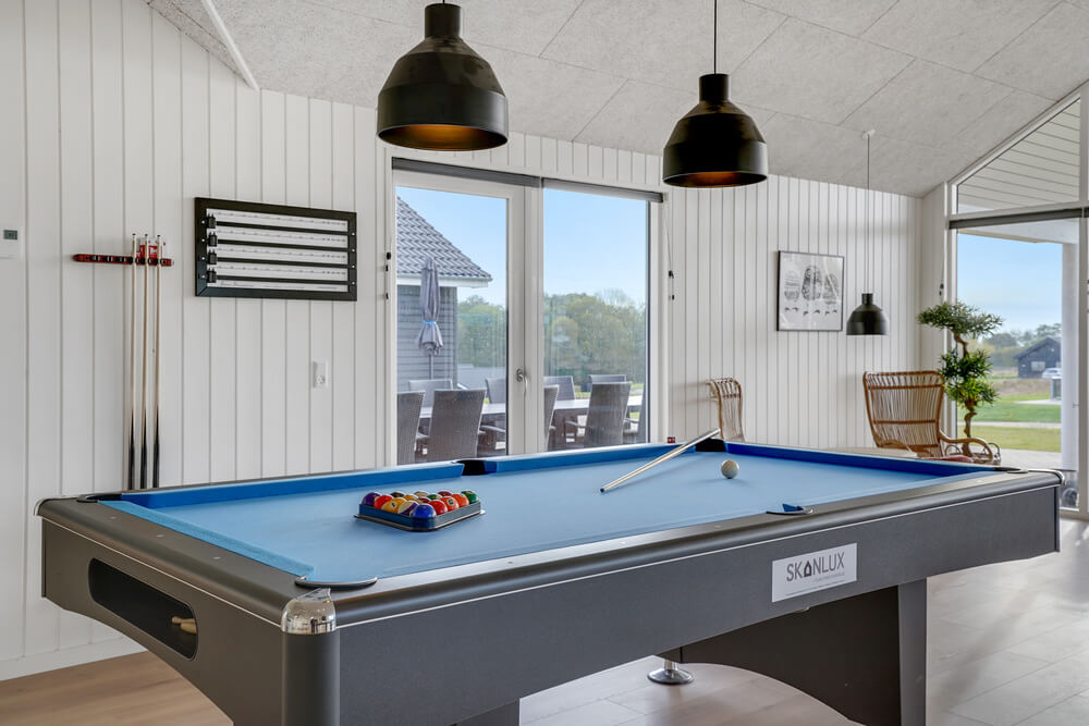Ud over de mange timer, man kan bruge i husets pool-afdeling, så byder luksushus 496 også på billard/bordtennis og dart