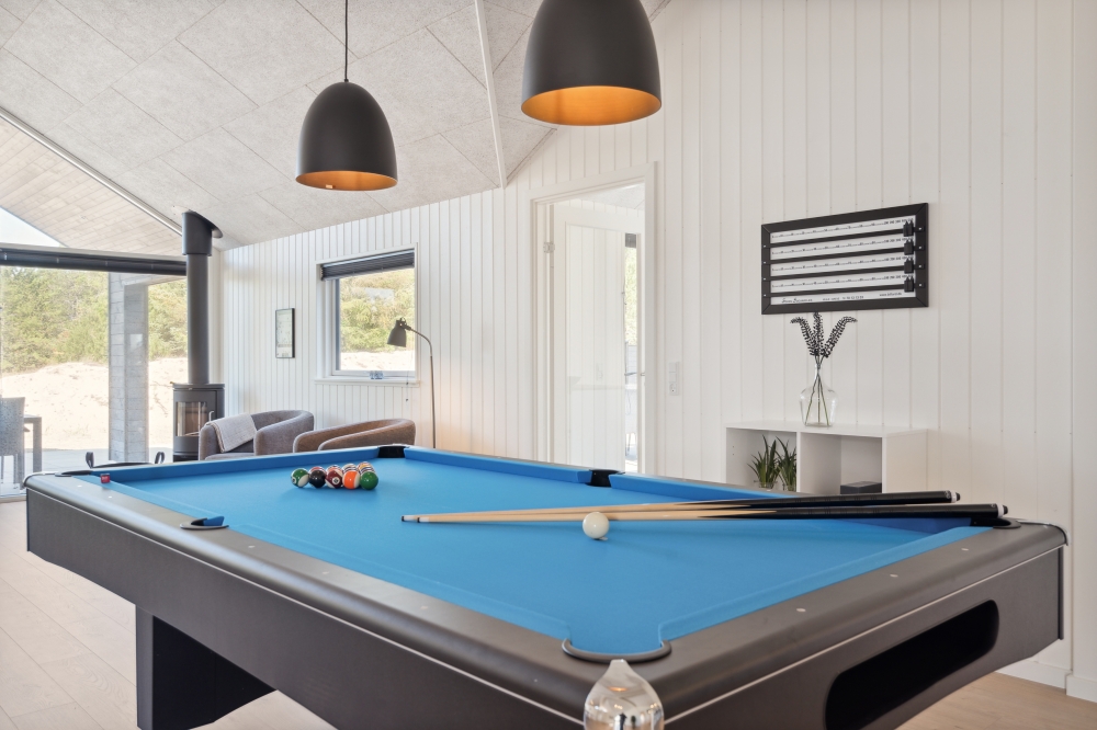 Ud over de mange timer, man kan bruge i husets pool-afdeling, så byder luksushus 585 også på billard/bordtennis og dart