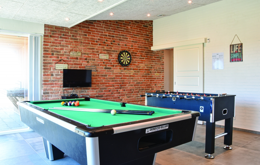Ud over de mange timer, man kan bruge i husets pool-afdeling, så byder luksushus 607 også på billard/bordtennis og dart