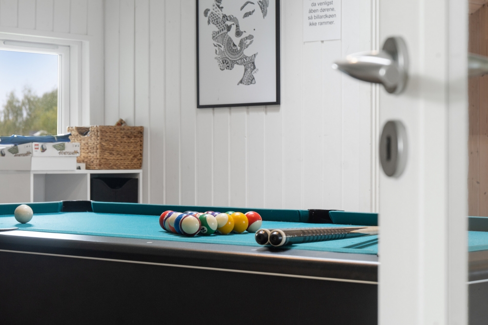 Ud over de mange timer, man kan bruge i husets pool-afdeling, så byder luksushus 212 også på billard/bordtennis og dart