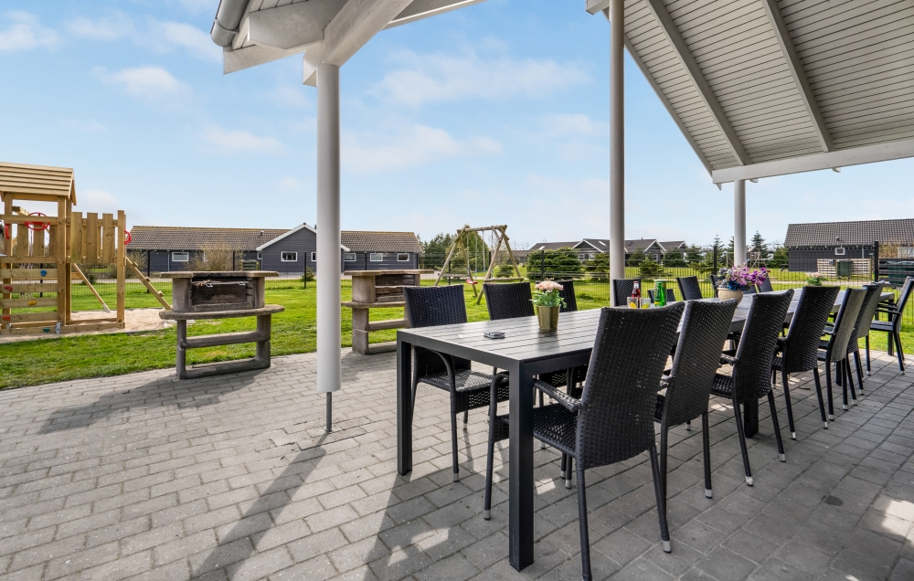 Nyd en grillaften på terrassen i luksushus nr. 202 i Lolland/Falster/Møn